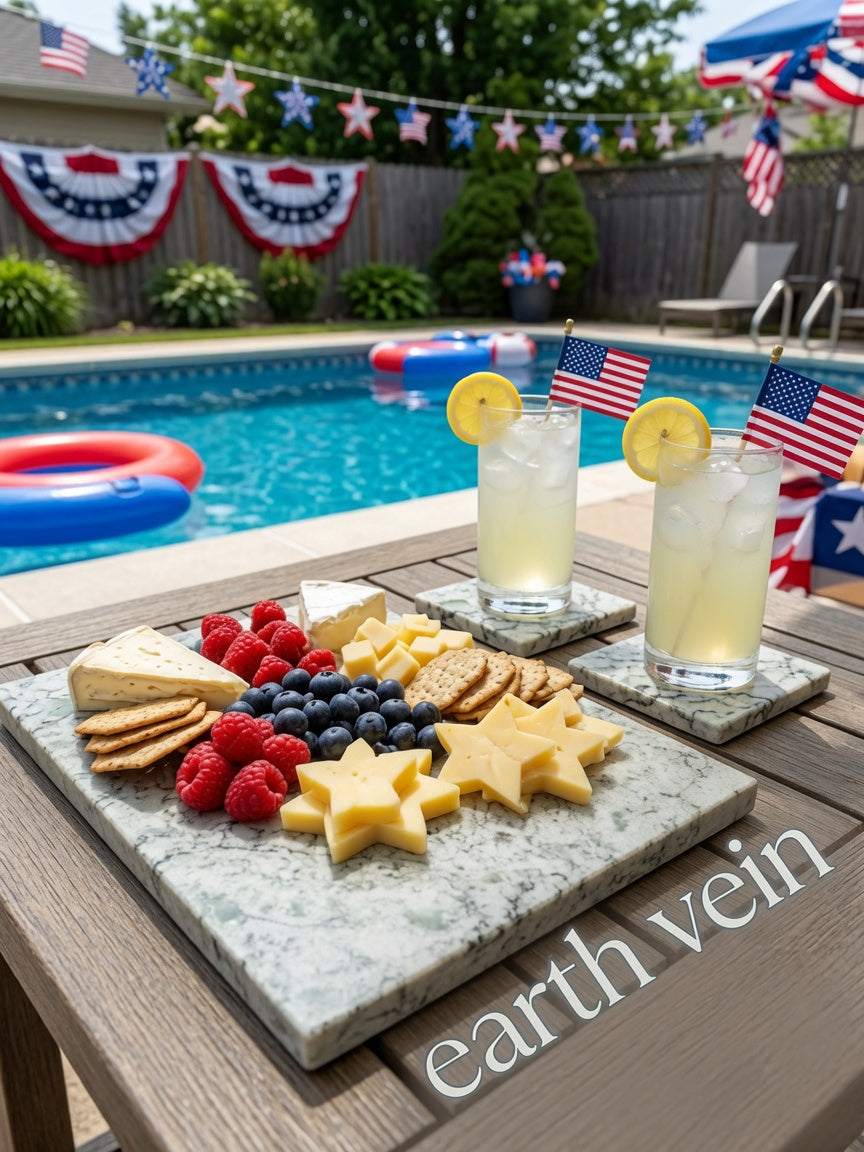Marmo Verde green-veined quartz serving board with matching coasters, cheese, berries, crackers and cocktails